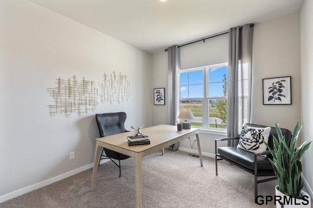 carpeted home office with visible vents and baseboards