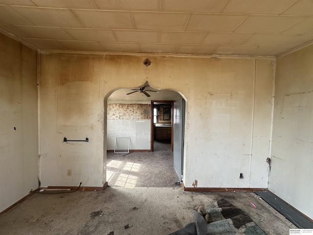 empty room featuring arched walkways