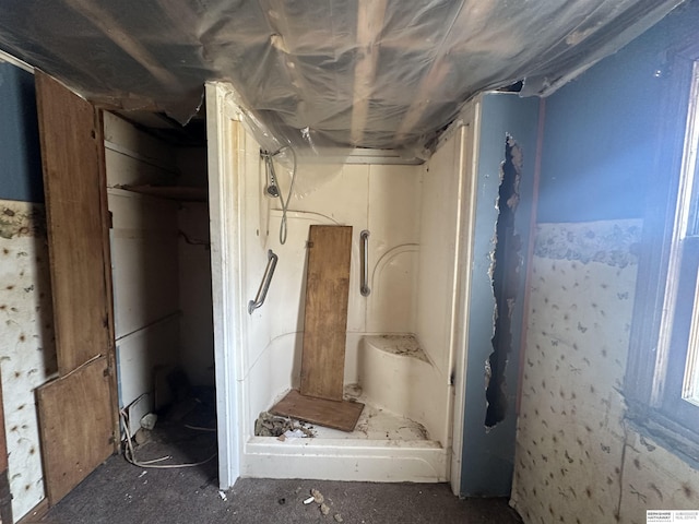 full bathroom featuring a shower stall