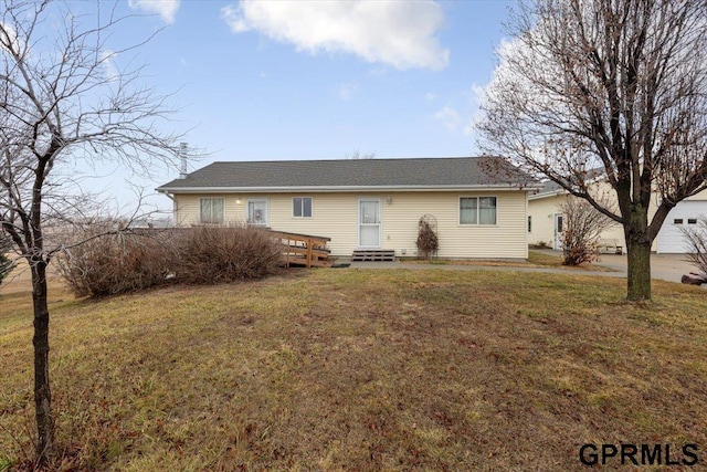 single story home with entry steps and a front lawn