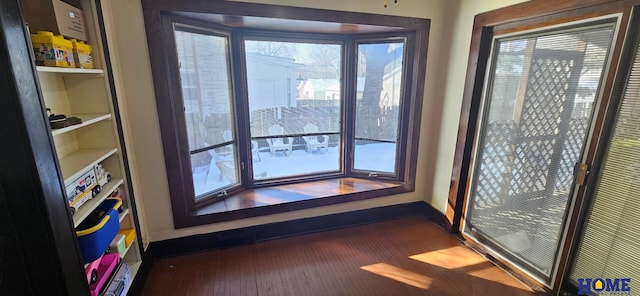 interior space featuring visible vents, baseboards, and wood finished floors