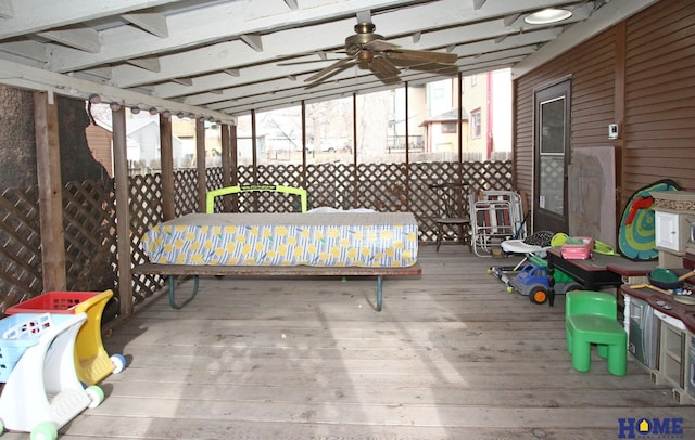 sunroom / solarium with ceiling fan