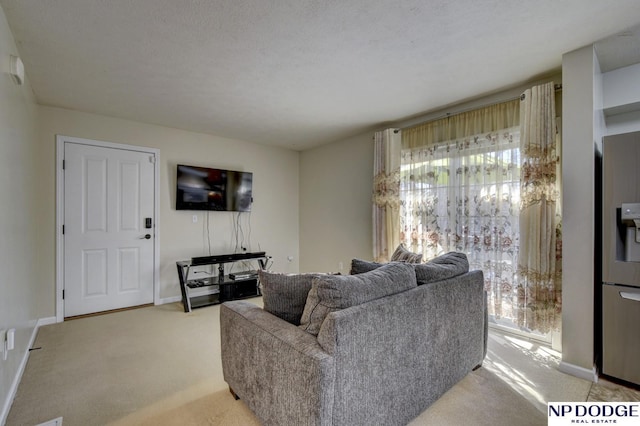 living area with light carpet and baseboards