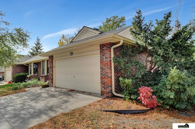 view of front of property with a garage, brick siding, roof with shingles, and driveway