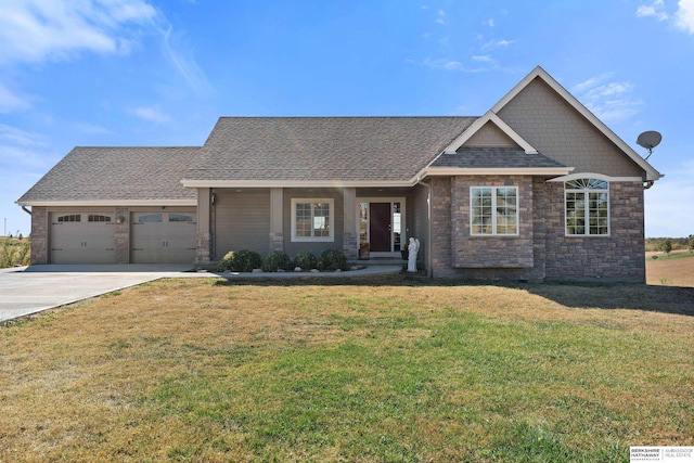 view of front of house featuring driveway, an attached garage, a front yard, and roof with shingles