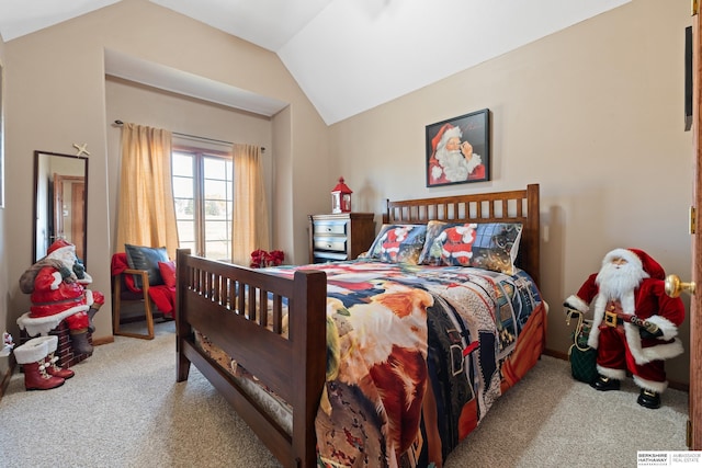 bedroom featuring lofted ceiling and carpet floors