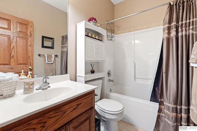 bathroom with vanity, tile patterned floors, toilet, and shower / bath combo with shower curtain