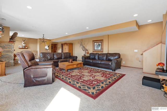 living area featuring recessed lighting, visible vents, baseboards, and carpet