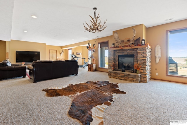 living area featuring visible vents, recessed lighting, carpet floors, a stone fireplace, and baseboards