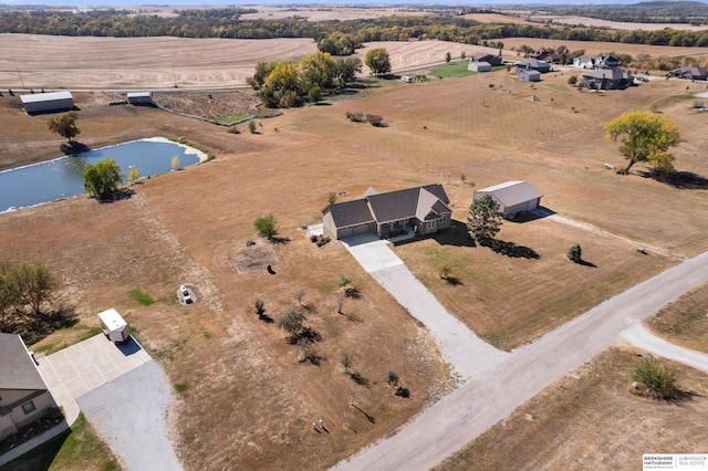 aerial view featuring a rural view and a water view