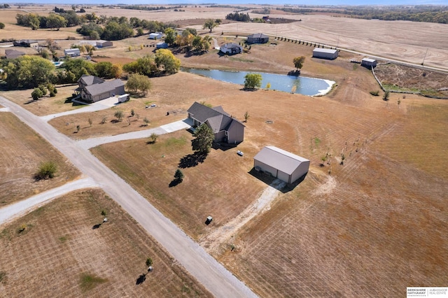 bird's eye view featuring a water view and a rural view