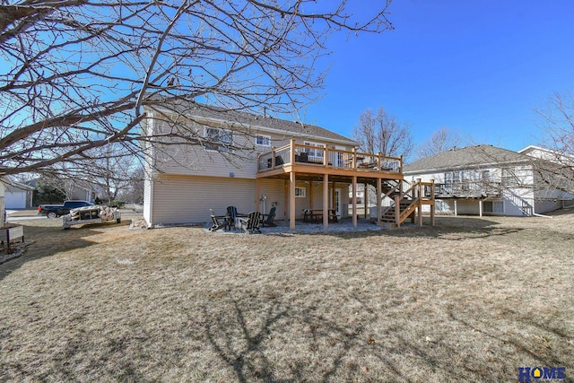 back of house featuring stairway and a wooden deck