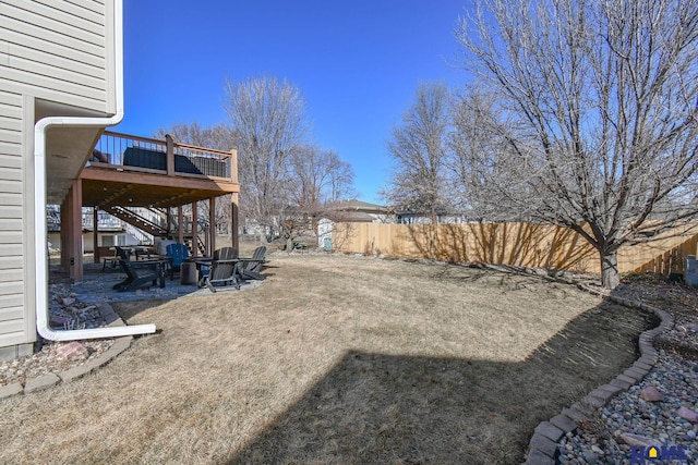 view of yard featuring stairway, a patio, a deck, and fence