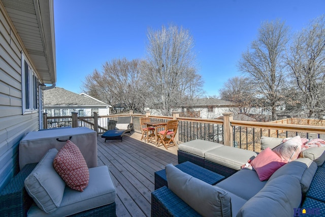 wooden terrace featuring an outdoor living space