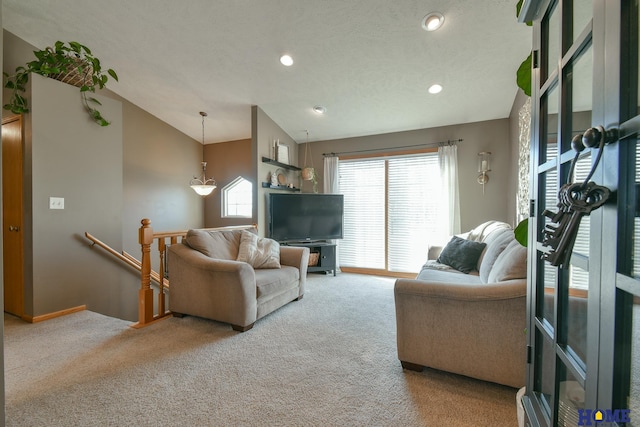 carpeted living area featuring vaulted ceiling and recessed lighting