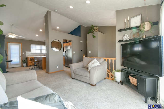 carpeted living area featuring recessed lighting, baseboards, lofted ceiling, and ceiling fan