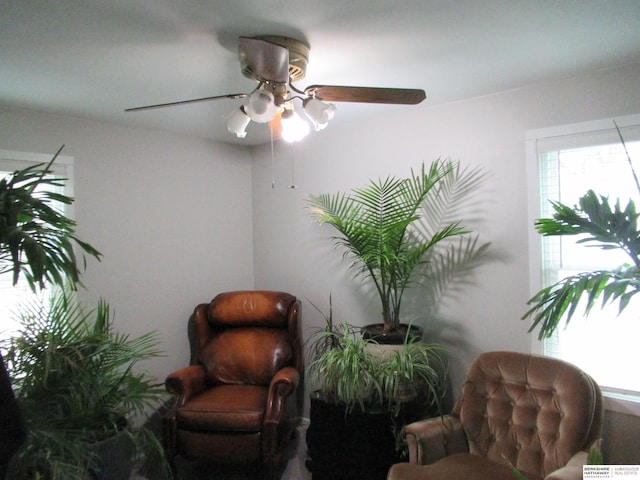 living area featuring ceiling fan