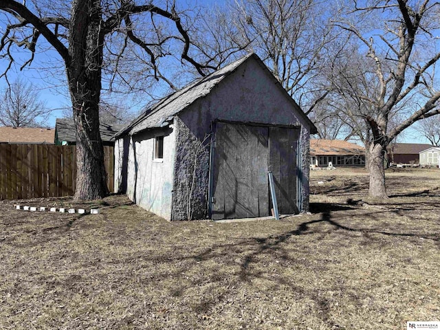 view of shed with fence