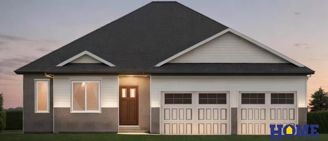 view of front of home featuring a garage and driveway