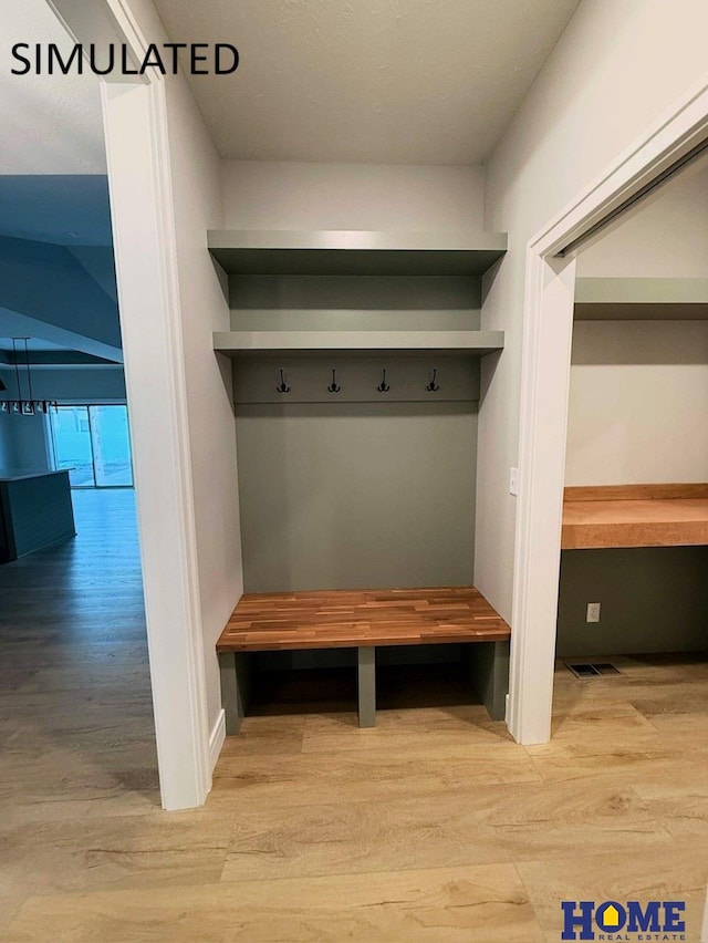 mudroom featuring light wood-style floors