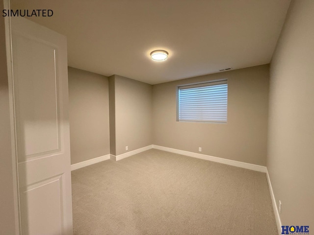 carpeted empty room with baseboards and visible vents