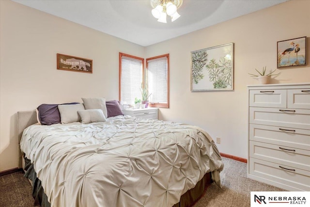 carpeted bedroom featuring baseboards