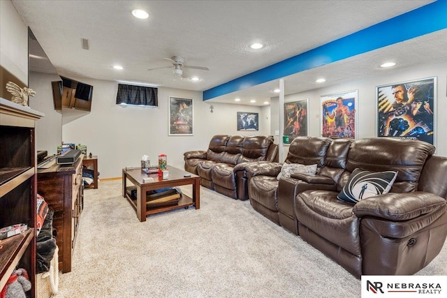 cinema room featuring recessed lighting, visible vents, light carpet, and a textured ceiling