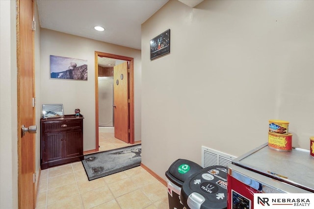 hallway featuring recessed lighting and baseboards