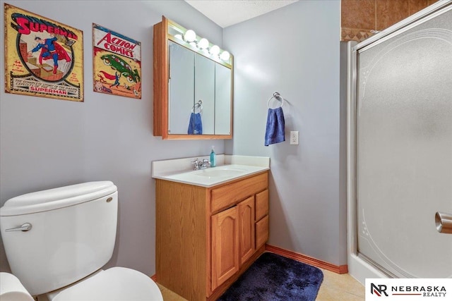 full bathroom featuring tile patterned flooring, baseboards, toilet, a shower with shower door, and vanity