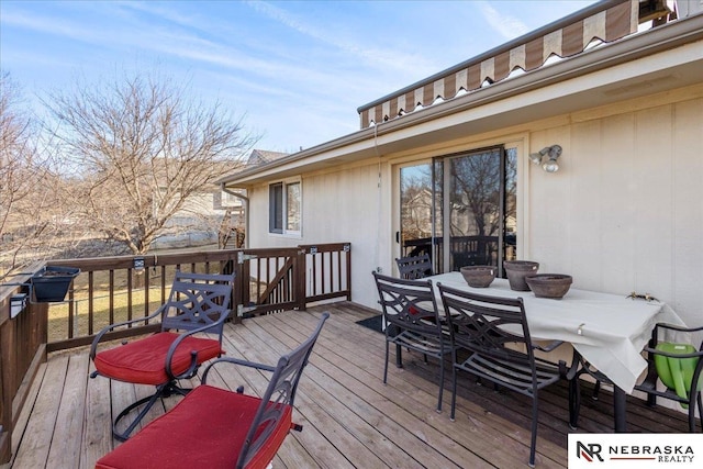 deck with outdoor dining area