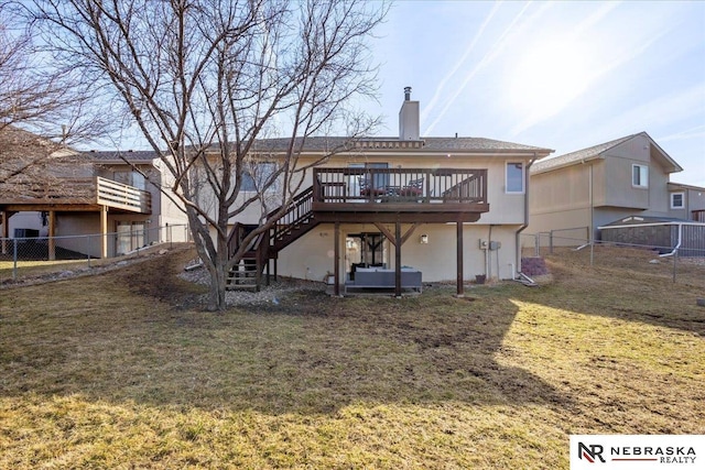 back of property with fence, a yard, a chimney, stairs, and a deck