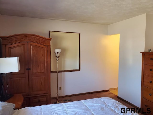 unfurnished bedroom with visible vents and baseboards