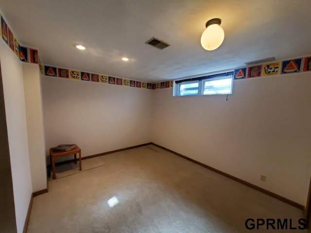 below grade area with recessed lighting, visible vents, and baseboards