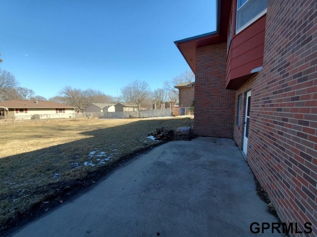 view of yard featuring a patio area and fence