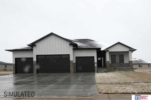 modern farmhouse featuring stone siding, board and batten siding, concrete driveway, and an attached garage