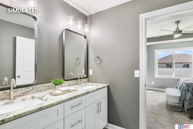 full bathroom featuring a sink, baseboards, ceiling fan, and double vanity