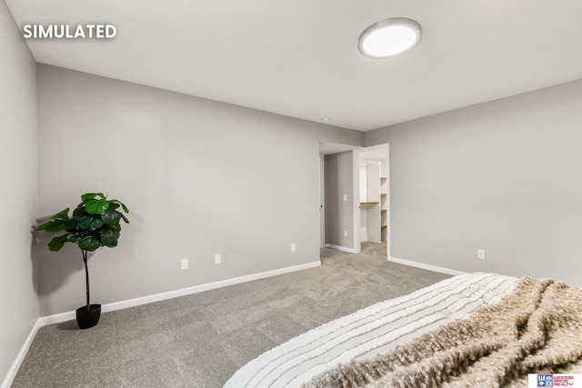 carpeted bedroom featuring baseboards