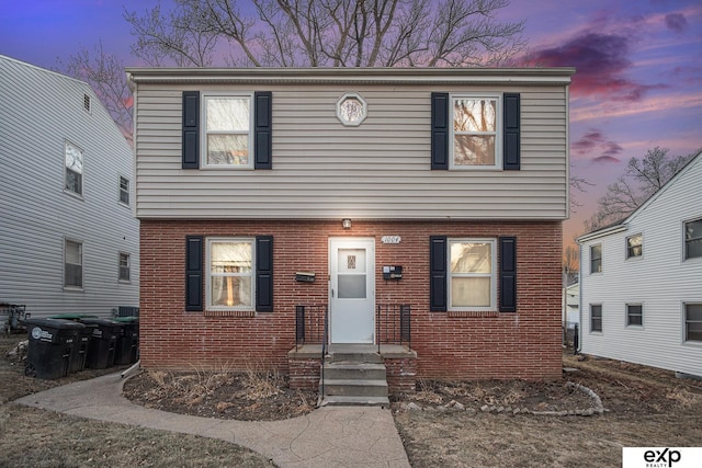 colonial house with brick siding