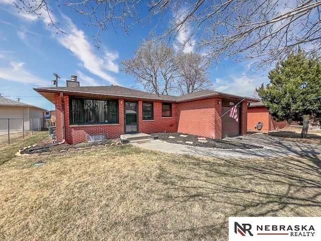 single story home with brick siding, a front lawn, fence, a chimney, and a garage