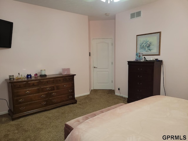 bedroom featuring visible vents, baseboards, and carpet