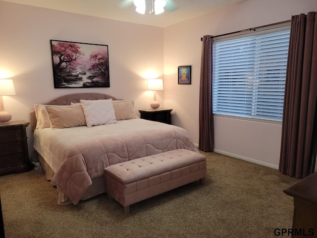 carpeted bedroom featuring ceiling fan and baseboards