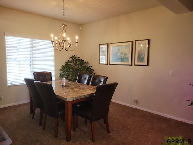 dining area with dark carpet, an inviting chandelier, and baseboards