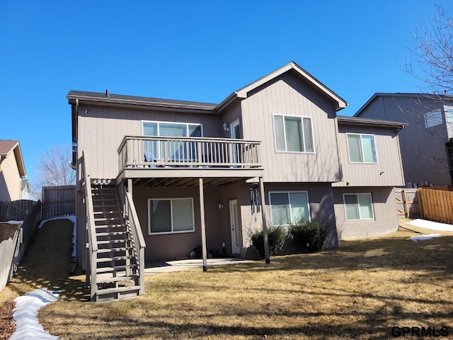 back of house featuring brick siding, stairs, a patio, and fence