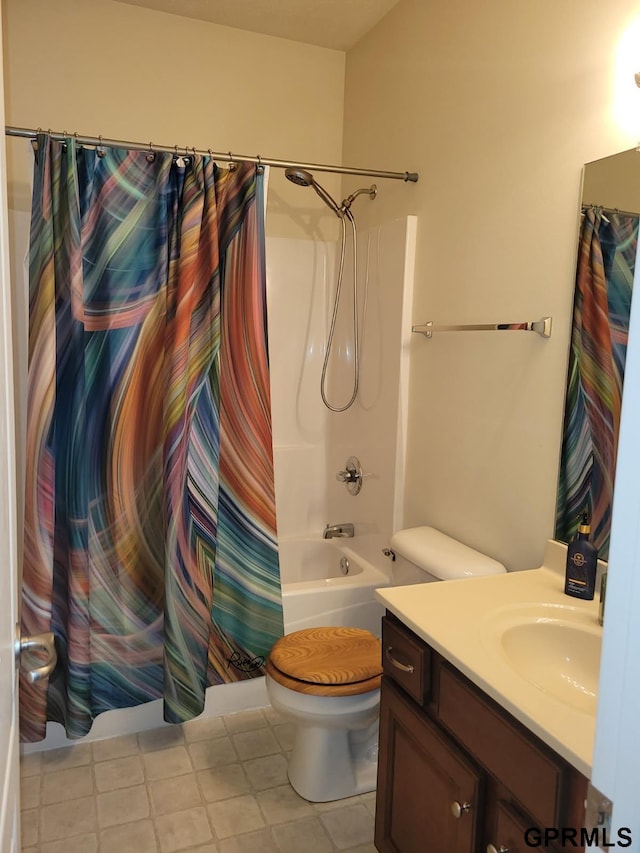 bathroom with vanity, toilet, and shower / bath combo with shower curtain