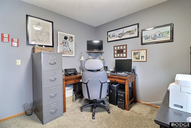 office space featuring baseboards, a textured ceiling, and carpet