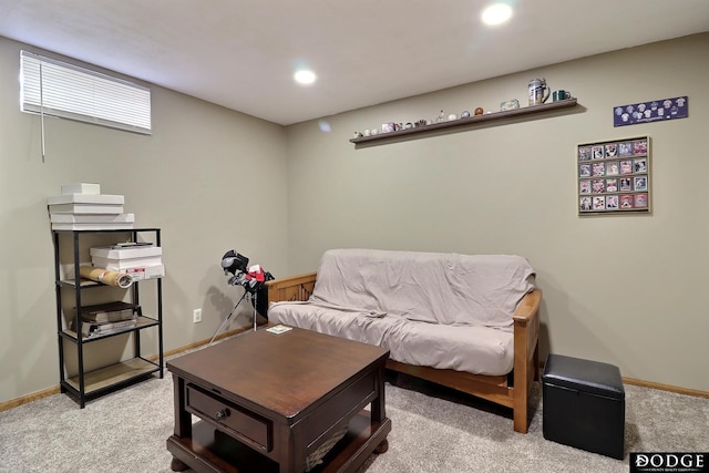 living area featuring light carpet, recessed lighting, and baseboards