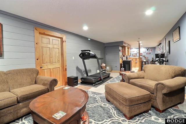 living room featuring tile patterned floors and recessed lighting