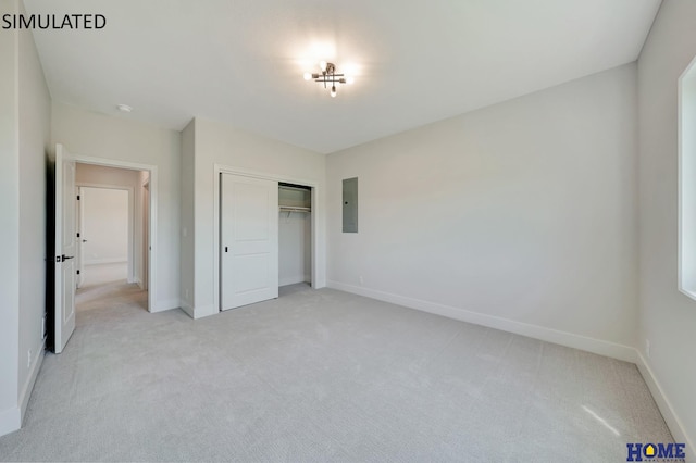 unfurnished bedroom with electric panel, baseboards, a closet, and light carpet