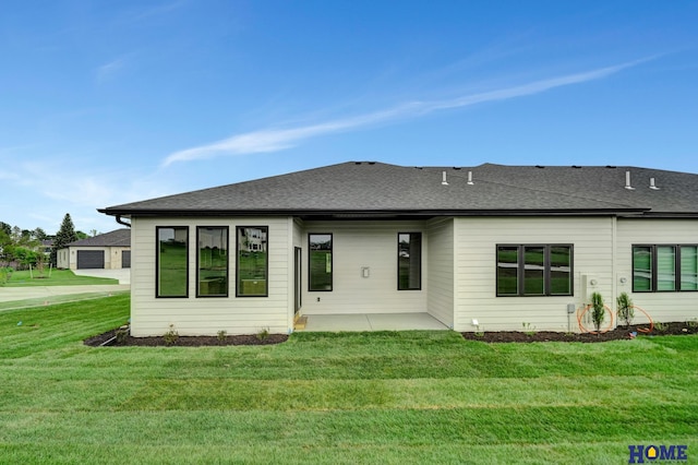9121 Triana Ct, Lincoln, NE 68520 - rear view of property with roof with shingles and a lawn