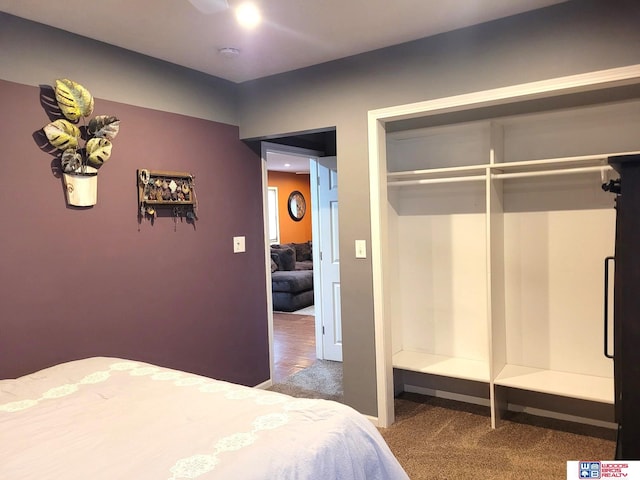 carpeted bedroom with a closet